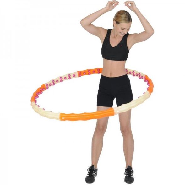 The girl turns the hoop
